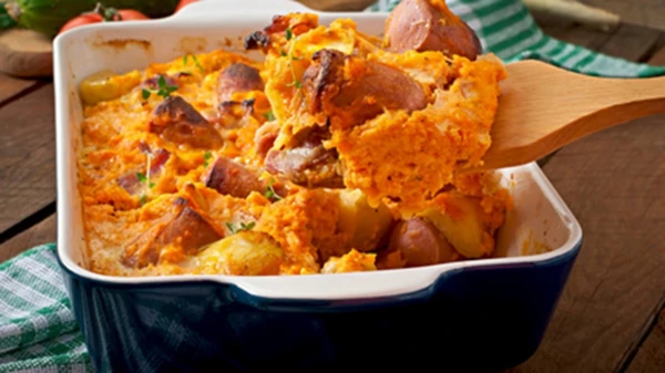 Pumpkin with Sausages and Spicy Harissa Sauce: A Hearty Autumn Dish in the Oven