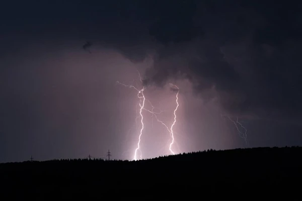 Lightning Strikes Two Men Taking Photos