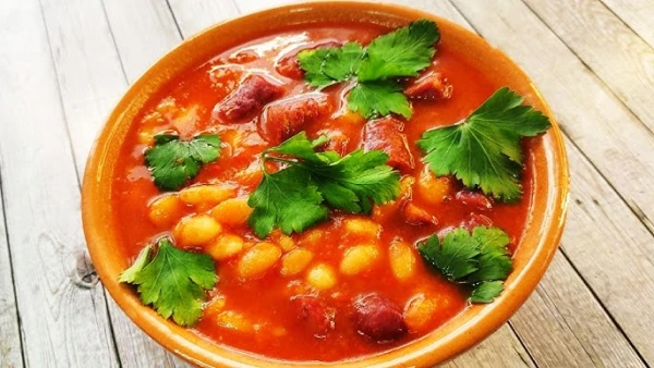 Warm and Hearty: Cooking Spicy Soup with Sausages and Beans