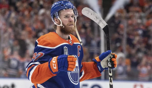 NHL. Edmonton forward Connor McDavid matched the century record