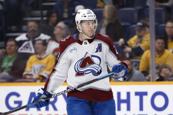 NHL. Nathan MacKinnon is the first since Wayne Gretzky to be the top scorer in the NHL for the third consecutive year