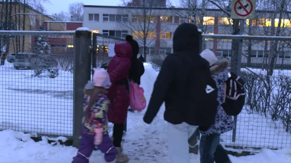 There is no cloakroom at Ilguciems Primary School — students carry their outerwear in bags or backpacks
