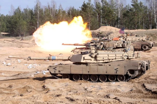 How will the two billion euro expenditure strengthen Latvia's defense?