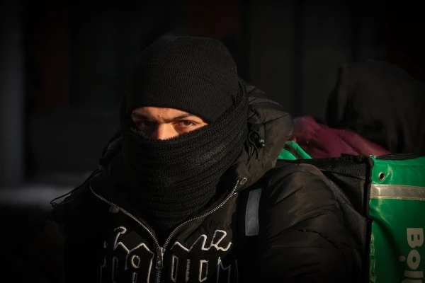 Are food delivery couriers from India, Pakistan, and other countries working legally in Latvia and paying taxes?