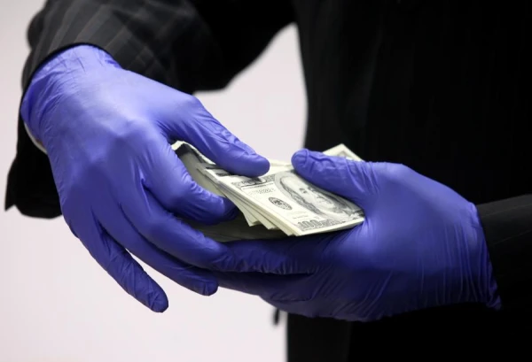 Whose signature will appear on the new American dollars?