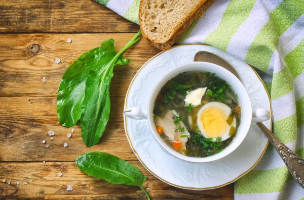 Preparation of Sorrel and Egg Soup in Chicken Broth