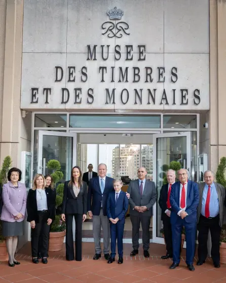 Prince Albert II of Monaco with his son Jacques and museum staff
